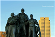 Pioneers Family bronze statue in front of ND State Capitol Building. 