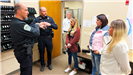 Bismarck PD officers explain how they utilize body cams during a Citizen Academy tour. 