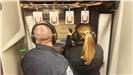 Citizen Academy attendees shoot at targets about 7 yards away, under officer guidance. 