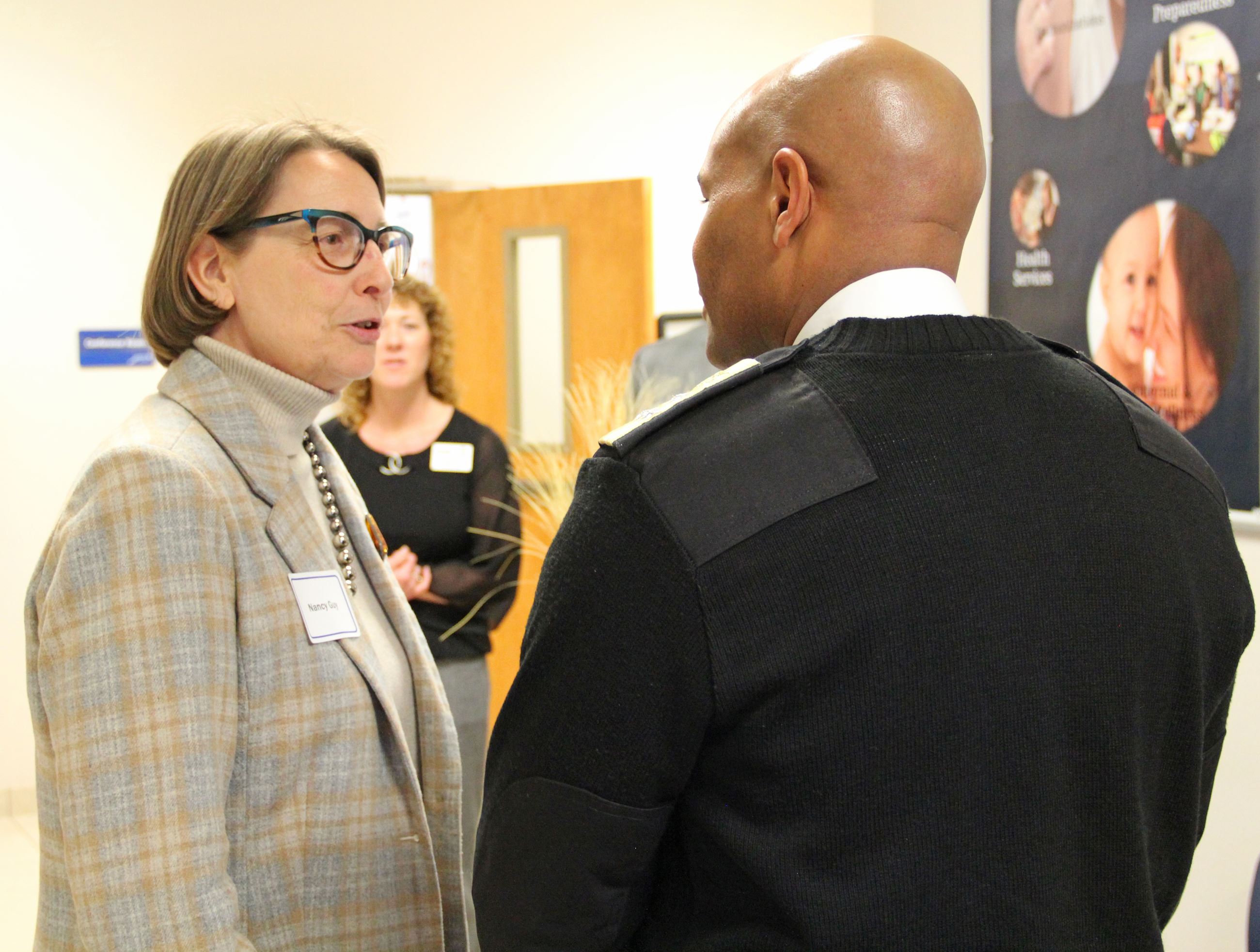 Nancy Guy speaking with Jerome Adams.JPG