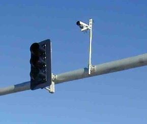 Video detection camera shown on top of traffic signal.