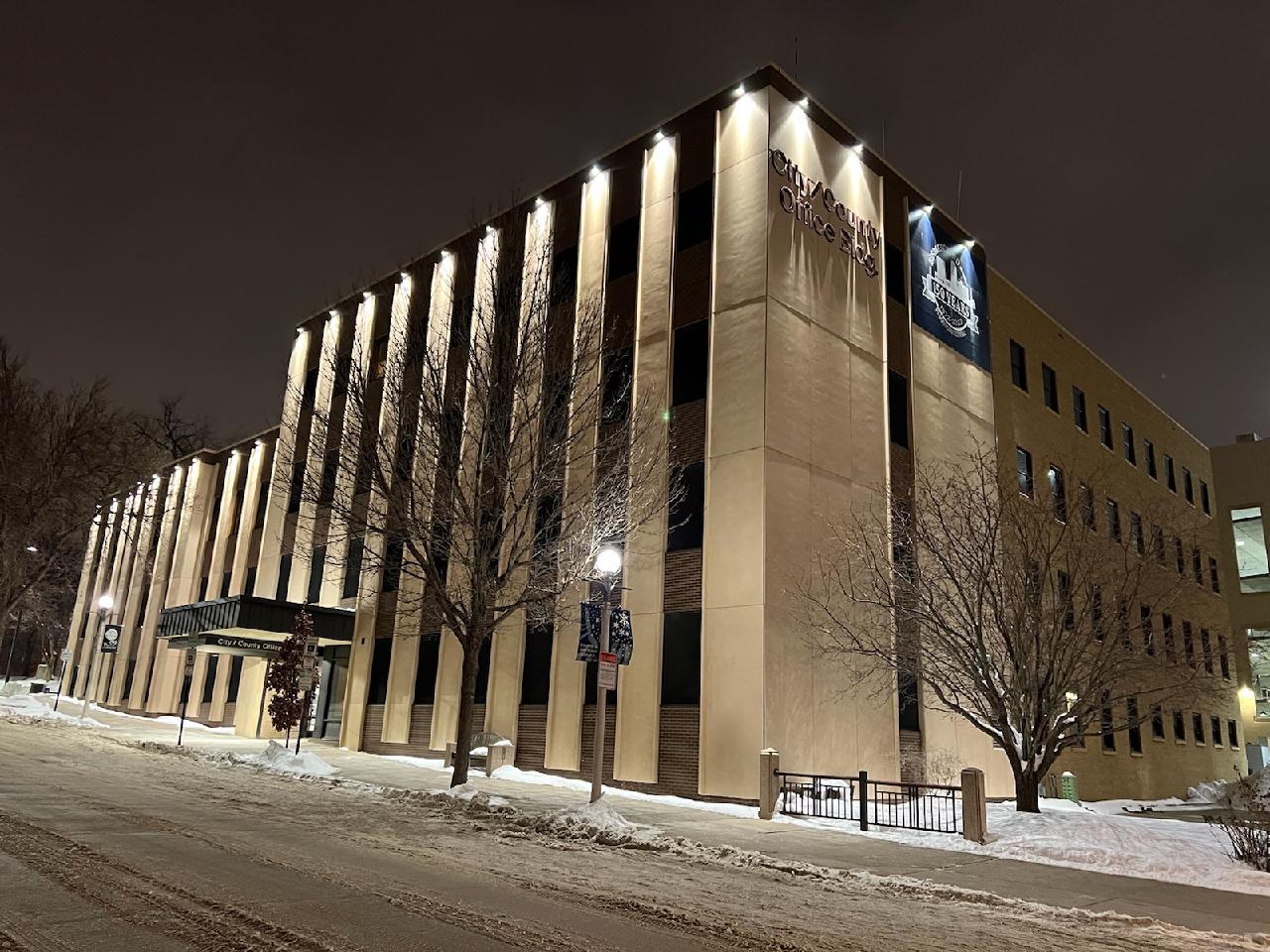 The City-County Building is shown at night from Fifth Street. 